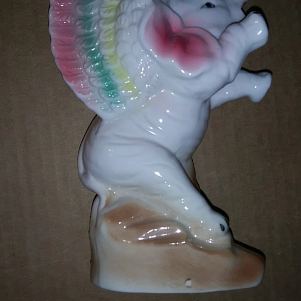 Vintage vase elephant with wings